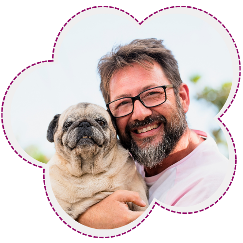 Man smiling holding pug