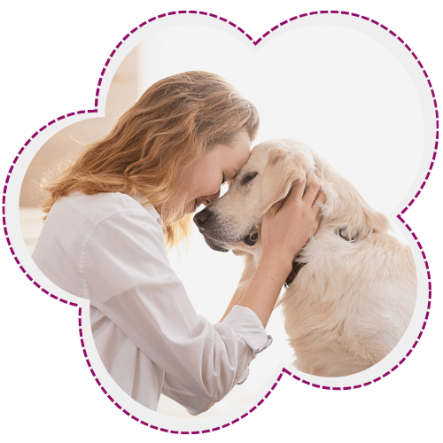 Woman embracing golden retriever